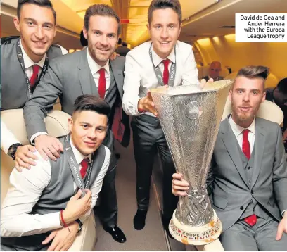  ??  ?? David de Gea and Ander Herrera with the Europa League trophy