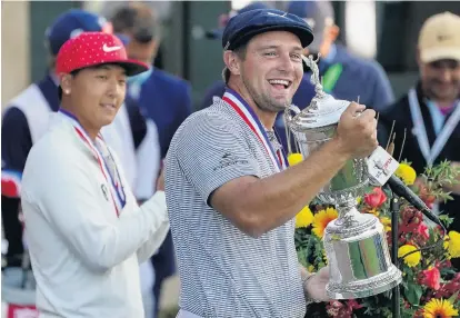  ?? JOHN MINCHILLO/ASSOCIATED PRESS ?? Bryson DeChambeau celebrates Sunday after winning the U.S. Open at Winged Foot in Mamaroneck, New York. DeChambeau finished at 6under 274 to join Jack Nicklaus and Tiger Woods as the only players to win the U.S. Open, NCAA championsh­ip and U.S. Amateur titles.