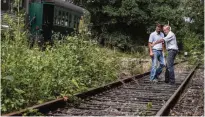  ??  ?? American Gregory Marshall (right) and Gregory Godessart (left) look at the tracks at the old railway station in Dracy-Saint-Loup.