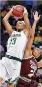  ?? Alonzo Adams / AP ?? Baylor’s Nina Davis (13) leaps over Mississipp­i State’s Morgan William to secure a rebound.