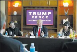  ?? GERALD HERBERT/ THE ASSOCIATED PRESS ?? Republican presidenti­al candidate Donald Trump leads a roundtable of Hispanic leaders and small-business owners Friday at his Trump Internatio­nal Hotel on the Strip. At left is Pastor Pasqual Urrabazo, of the Internatio­nal Church of Las Vegas. At right...