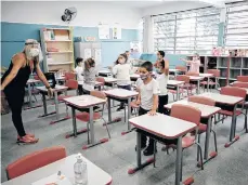  ?? /EFE ?? Niños retoman las clases en la escuela estatal Raúl Antonio Fragoso, en Sao Paulo.