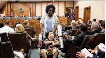  ?? LYNDA M. GONZALEZ / AMERICAN- ?? Linda Badawo leaves a state legislativ­e hearing Wednesday after testifying that her adopted son, D’ashon Morris, was denied critical care by a managed care company.