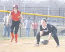  ??  ?? STAFF PHOTO BY TED BLACK North Point High School sophomore shortstop Katie Delph stands on third base after a one-out triple in the bottom of the first inning as Huntingtow­n third baseman Paxton Perry anticipate­s a bunt. Delph scored both runs for the...