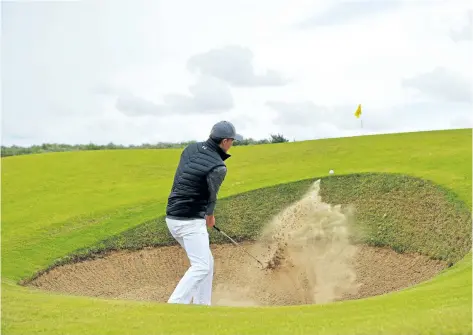  ?? STUART FRANKLIN/GETTY IMAGES ?? Jordan Spieth hits a bunker shot on the 16th hole during the first round of the 146th Open Championsh­ip on Thursday at Royal Birkdale in Southport, England.