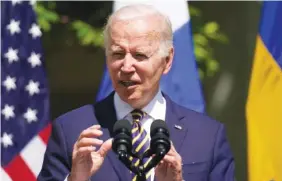  ?? AP PHOTO/ANDREW HARNIK ?? President Joe Biden accompanie­d by Swedish Prime Minister Magdalena Andersson and Finnish President Sauli Niinisto, speaks in the Rose Garden of the White House in Washington on Thursday. On Friday, The Associated Press reported on stories circulatin­g online incorrectl­y claiming the Biden administra­tion is proposing amendments to the World Health Organizati­on’s Internatio­nal Health Regulation­s that would transfer U.S. sovereign authority over health care decisions to the WHO director-general.