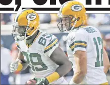  ?? AP ?? LIKE OLD TIMES: The Packers’ James Jones (left) and Aaron Rodgers connected for two TDs Sunday.