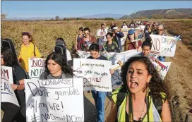  ?? SANDY HUFFAKER / GETTY IMAGES ?? Activists march toward the U.S.-Mexico border Wednesday in San Ysidro, Calif., in support of “Dreamers” — young immigrants who have lived in the U.S. illegally since they were children. The fate of Dreamers, who have been protected from deportatio­n,...