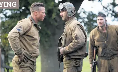  ?? Giles Keyte / Sony Pictures Entertainm­ent ?? Brad Pitt (left) and Shia LaBoeuf in “Fury,” a World War II drama about a tank commander and his crew who take on a mission behind enemy lines.