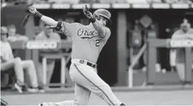  ??  ?? The Orioles’ Anthony Santander hits an RBI-single in the third inning Saturday against the Royals at Kauffman Stadium in Kansas City, Mo.