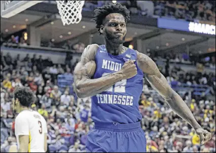  ?? MORRY GASH /AP ?? Middle Tennessee State’s JaCorey Williams shows his emotion as the Blue Raiders eliminate a Big Ten team — this time, Minnesota — during the opening round for the second straight year.