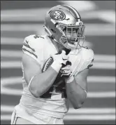  ?? CHRISTIAN PETERSEN/GETTY IMAGES ?? Fullback Kyle Juszczyk (44) of the San Francisco 49ers catches a touchdown pass against the Arizona Cardinals on Dec. 26, 2020 in Glendale, Ariz.