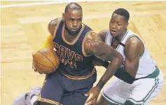  ??  ?? LeBron James of the Cleveland Cavaliers dribbles against Terry Rozier of the Boston Celtics in Eastern Conference Finals at TD Garden in Boston, Massachuse­tts. — AFP photo