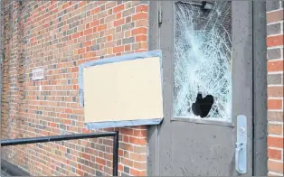  ?? GARY KEAN/ THE WESTERN STAR ?? The broken glass in this door at the rear of Holy Redeemer Parish cathedral in Corner Brook shows how a burglar gained entry into the church this past weekend.