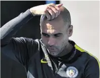  ??  ?? Pause for thought: Manchester City manager Pep Guardiola during a training session