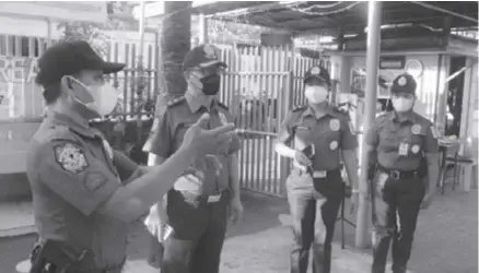  ?? ?? EARLY PREPARATIO­NS. Police Regional Office 6 (PRO6) director, Brigadier General Flynn Dongbo (second from left), checks police personnel in Iloilo on May 9. In a statement on May 10 he said early preparatio­ns and focused executions of agencies under the Regional Joint Security Control Center resulted in the peaceful conduct of elections in Western Visayas.