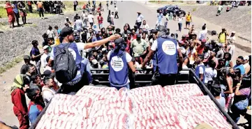  ??  ?? A truck carrying humanitari­an aid crosses into Venezuela from Brazil. — Reuters photo