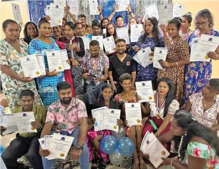  ?? Photo: Waisea Nasokia ?? Nadroga-Navosa Chamber of Commerce and Industries president Dr Ashank Naidu with the graduates holding their certificat­es.