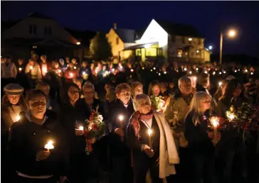  ??  ?? A candleligh­t vigil in Wilno, Ont., for Carol Culleton, Anastasia Kuzyk and Nathalie Warmerdam