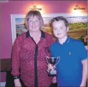  ??  ?? Catherine Lang presents the best dressed trophy to Alfie Campbell.