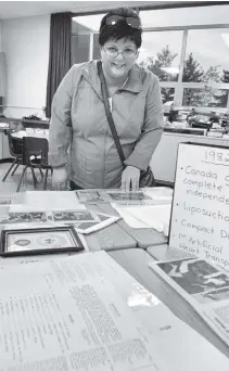  ?? [LIZ BEVAN / THE OBSERVER] ?? Pearl Frey takes a stroll through the 1980s at the Linwood PS anniversar­y celebratio­ns last week. Secretary Liz Shantz, principal Shawn Thompson and EA Donna Dammeier serve cake to visitors. Betty Theissen, Cindy Matthews and Margaret Dahmer were all...