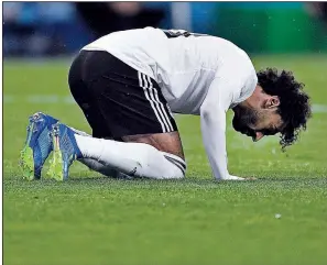  ?? Egypt’s Mohamed Salah prays on the ground after scoring a penalty during the group A match between Russia and Egypt at the 2018 soccer World Cup in the St. Petersburg stadium in St. Petersburg, Russia, on June 19. AP/MARTIN MEISSNER ??