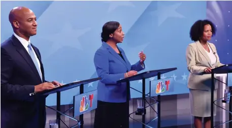  ?? CHRiS CHRiSTo pHoToS / HeRald STaFF ?? WHO BROKE OUT? City Councilor Andrea Campbell speaks during Wednesday’s mayoral debate as hopeful John Barros and Acting Mayor Kim Janey look on. Below, moderator Shannon Mulaire of NBC10 Boston addresses the field of five.