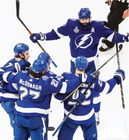  ?? AP ?? Kevin Shattenkir­k (22) celebrates his goal in the first period — the third in a span of four shots — that gave the Lightning a 3-0 lead.