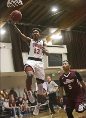  ?? File photo ?? Justin Collins (13) is a key returner for this year’s SCCS boys basketball team. He’s joined by a plethora of talented transfers who have already made an impact.