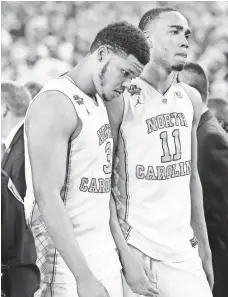  ?? BOB DONNAN, USA TODAY SPORTS ?? North Carolina’s Kennedy Meeks, left, and Brice Johnson react Monday after losing to Villanova in the NCAA title game.