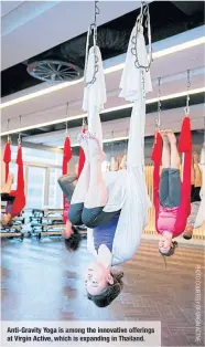  ??  ?? Anti- Gravity Yoga is among the innovative offerings at Virgin Active, which is expanding in Thailand.