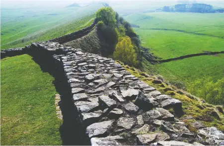  ?? GETTY IMAGES/ISTOCKPHOT­O ?? Part of England's ancient Hadrian's Wall, the historic monument that helped inspire George R.R. Martin to write his Game of Thrones series, is attracting tourists and fans.