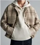  ?? ?? Agnona sources the finest natural fibres to create exquisite textiles, such as this cashmere jacket and cotton hoodie (below), cashmere-silk sweater (bottom) and cashmere coat (facing page).