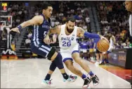  ?? JEFF SWINGER - THE ASSOCIATED PRESS ?? Sixers guard Grant Riller (26) drives against Memphis Grizzlies guard Tremont Waters during the second half of an NBA summer league game Tuesday in Salt Lake City.