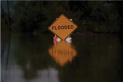  ?? ?? A flood sign during a storm in Whittier, California, on 6 February 2024. Photograph: Eric Thayer/Bloomberg via Getty Images