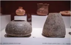  ?? ?? Soft-stone vessels from the Bronze Age are on display