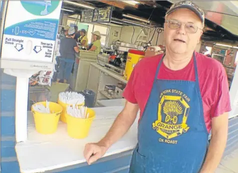  ?? JOHN HAEGER @ONEIDAPHOT­O ON TWITTER — ONEIDA DAILY DISPATCH PHOTOS ?? Roland Shea stands outside of the NYS Grange OX Roast at the NYS Fair in Geddes on Thursday. The fair runs through Labor Day.