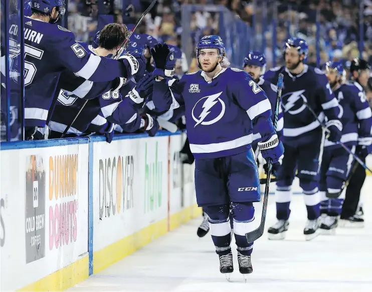  ?? — GETTY IMAGES ?? Brayden Point scored an empty-net goal and had three assists as the Tampa Bay Lightning scored a 4-2 victory over the visiting Boston Bruins Monday night.
