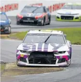  ?? BRIAN LAWDERMILK/GETTY ?? Jimmie Johnson, driver of the #48 Ally Chevrolet, leads the field during the NASCAR Cup Series Go Bowling 235.