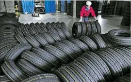  ?? Associated Press ?? AFTER A TIRE levy was placed on China in 2009, the increase of imports to the U.S. from other countries outpaced the growth seen in domestic tire production.