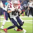  ?? Brett Coomer / Houston Chronicle ?? Patriots quarterbac­k Mac Jones (10) avoids a sack by Texans defensive end Whitney Mercilus on Sunday.