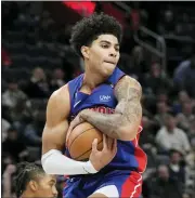  ?? CARLOS OSORIO — THE ASSOCIATED PRESS ?? Detroit Pistons guard Killian Hayes (7) pulls down a rebound during overtime of Thursday’s game against the Dallas Mavericks in Detroit.
