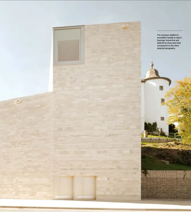  ??  ?? The museum addition’s monolithic facade is clad in Gauinger travertine and defined by three tiers that correspond to the site’s sloping topography.