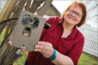  ?? Herald photo by Ian Martens ?? University of Lethbridge graduate student Leila Armstrong is using trail cameras in a project to find out more about urban wildlife and residents’ attitudes toward backyard wilderness. @IMartensHe­rald