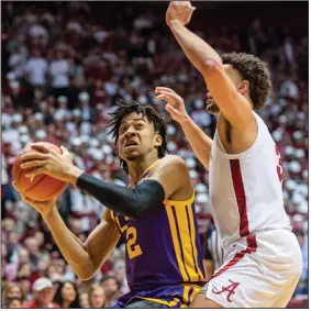  ??  ?? LSU forward Trendon Watford (2) works inside against Alabama forward Alex Reese (3) during the Tigers’ 88-82 loss on Saturday. LSU, which has lost three of its past four games, has struggled defensivel­y, giving up 92.7 points per game in losses to Vanderbilt, Auburn and Alabama. (AP/Vasha Hunt)