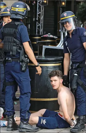  ??  ?? Held: Police arrested fans in Marseille last night, ahead of tonight’s England game