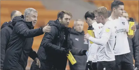  ?? Picture: Daniel Chesterton/phcimages.com ?? PEP TALK
Pompey boss Kenny Jackett issues some instructio­ns to midfielder Andy Cannon last night.