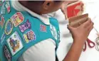  ?? PATRICK SEMANSKY/AP ?? New Girl Scouts badges are meant to help girls fill a leadership gap, especially in STEM fields.