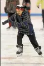  ??  ?? A young skater zips across the ice at the Thomas Eccleston Jr. Rink during free community skating at The Hill School in Pottstown.