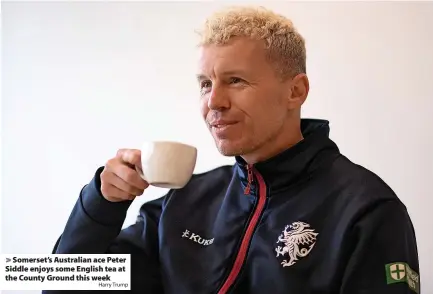  ?? Harry Trump ?? > Somerset’s Australian ace Peter Siddle enjoys some English tea at the County Ground this week